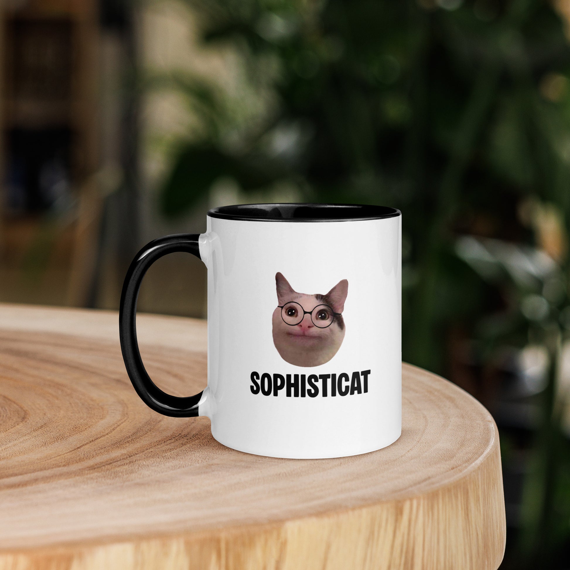 White ceramic mug with color inside featuring Beluga cat wearing glasses and "SOPHISTICAT" text