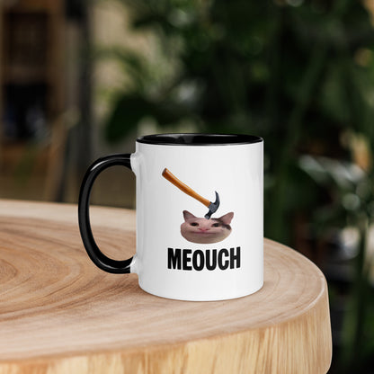 White ceramic mug with black inside featuring funny Meouch cat meme and hammer design