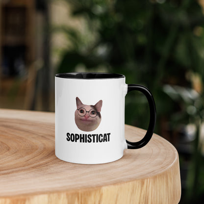 White ceramic mug with color inside featuring Beluga cat wearing glasses and "SOPHISTICAT" text
