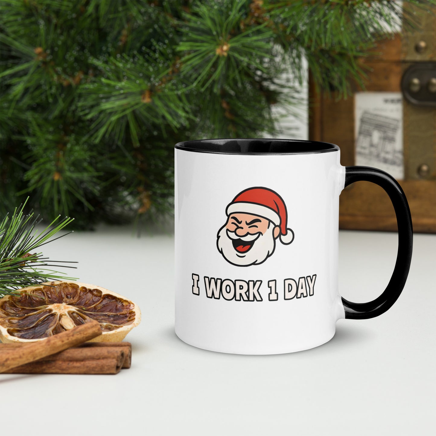 White ceramic mug with color inside featuring winking Santa Claus face and "I WORK 1 DAY" text