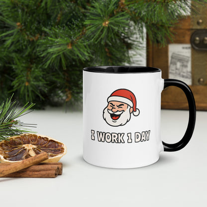 White ceramic mug with color inside featuring winking Santa Claus face and "I WORK 1 DAY" text