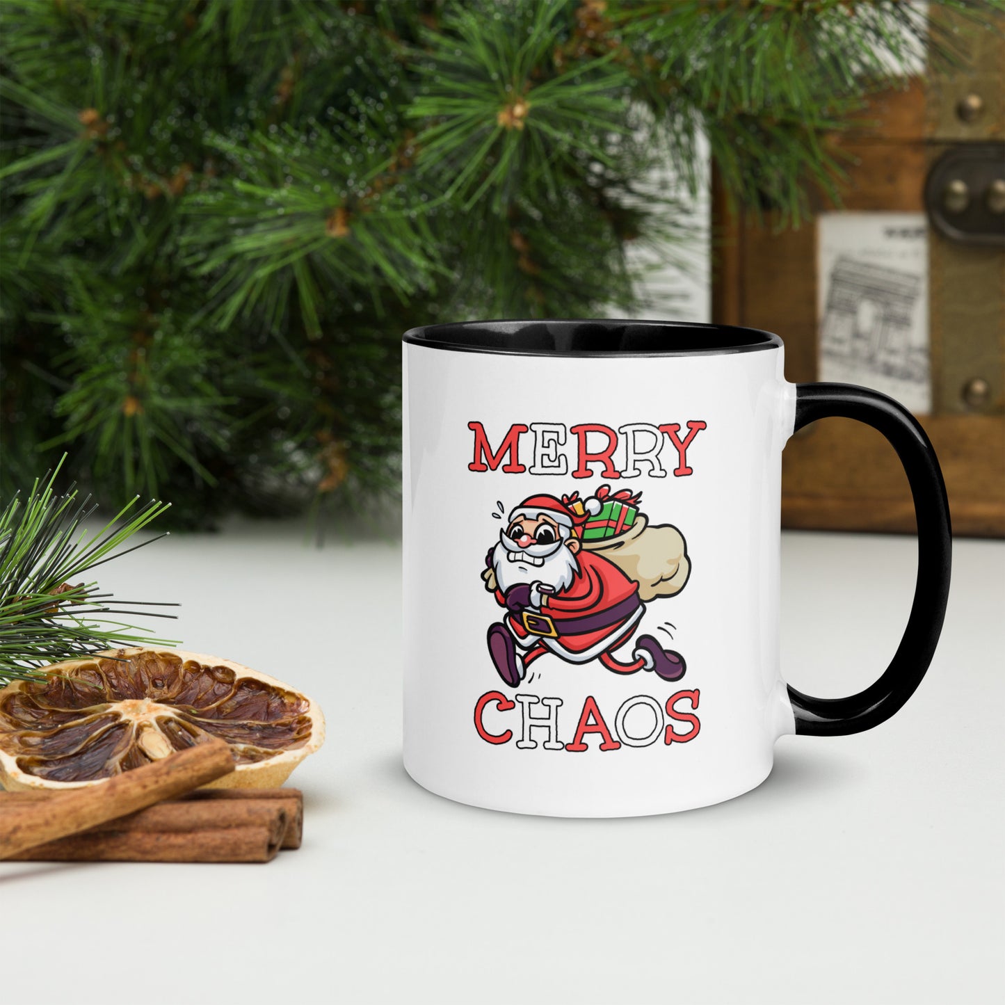 White ceramic mug with color inside featuring funny running Santa Claus and "MERRY CHAOS" text