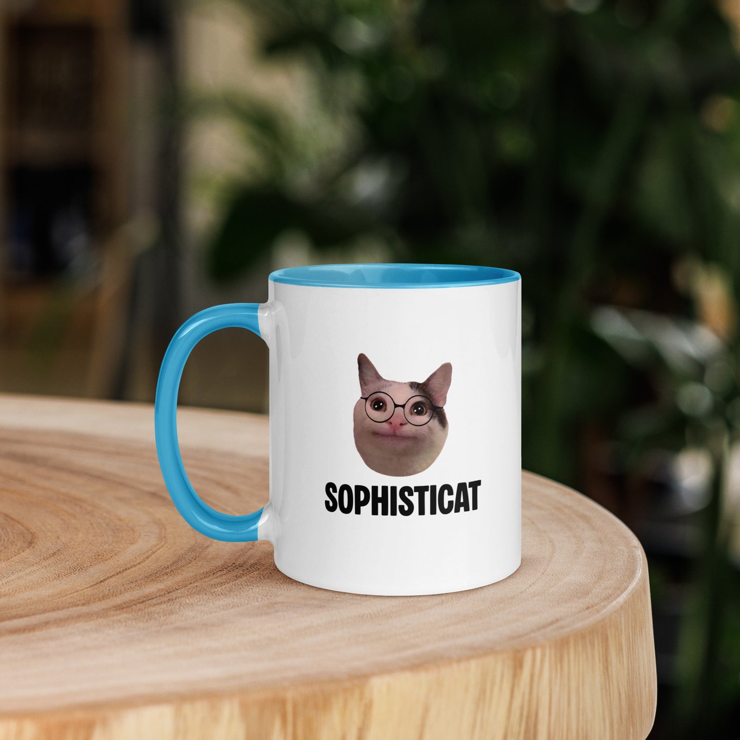 White ceramic mug with color inside featuring Beluga cat wearing glasses and "SOPHISTICAT" text