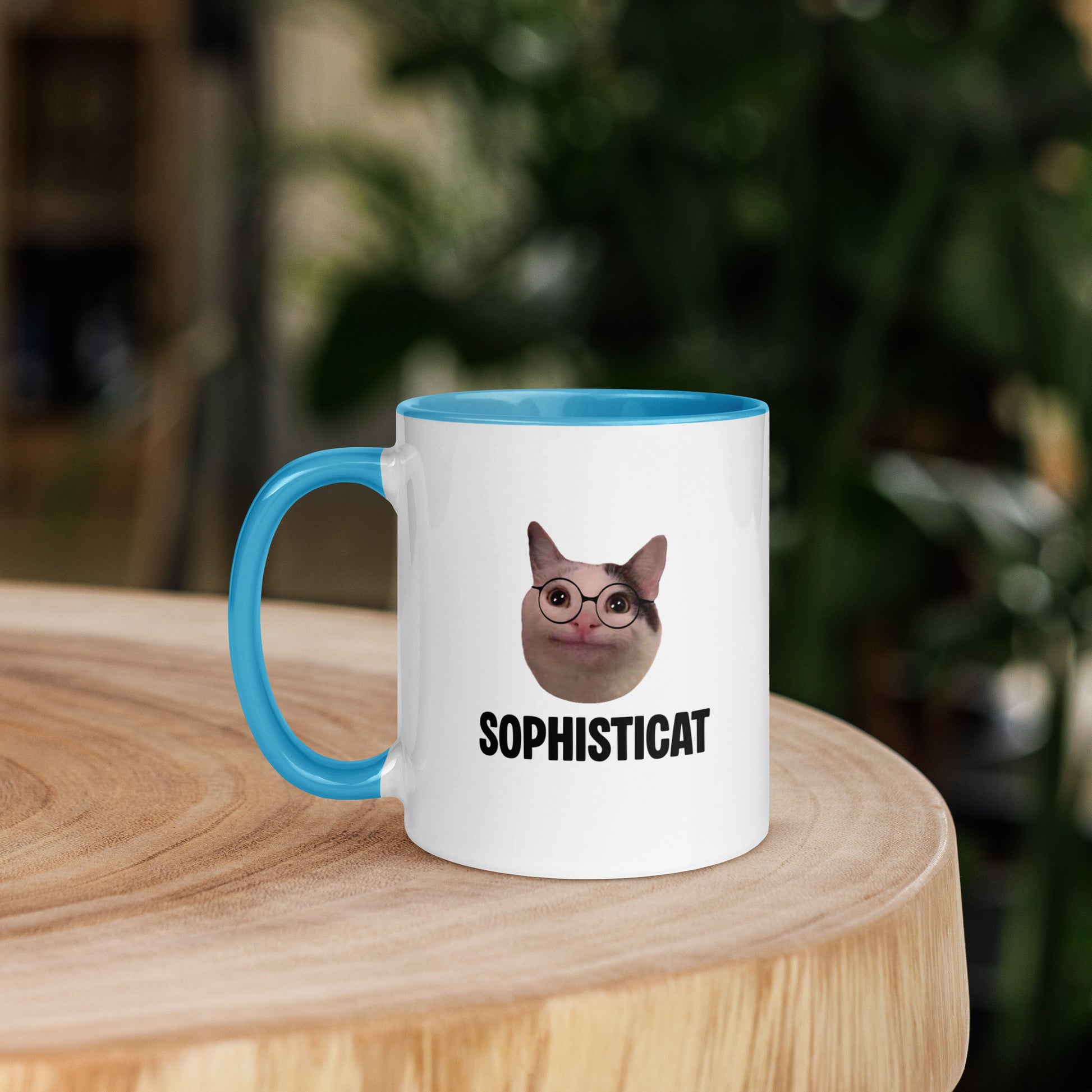 White ceramic mug with color inside featuring Beluga cat wearing glasses and "SOPHISTICAT" text