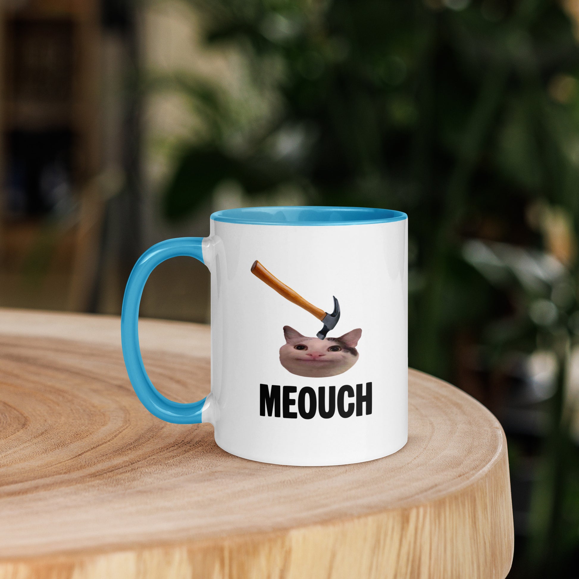 White ceramic mug with Color inside featuring funny Meouch cat meme and hammer design