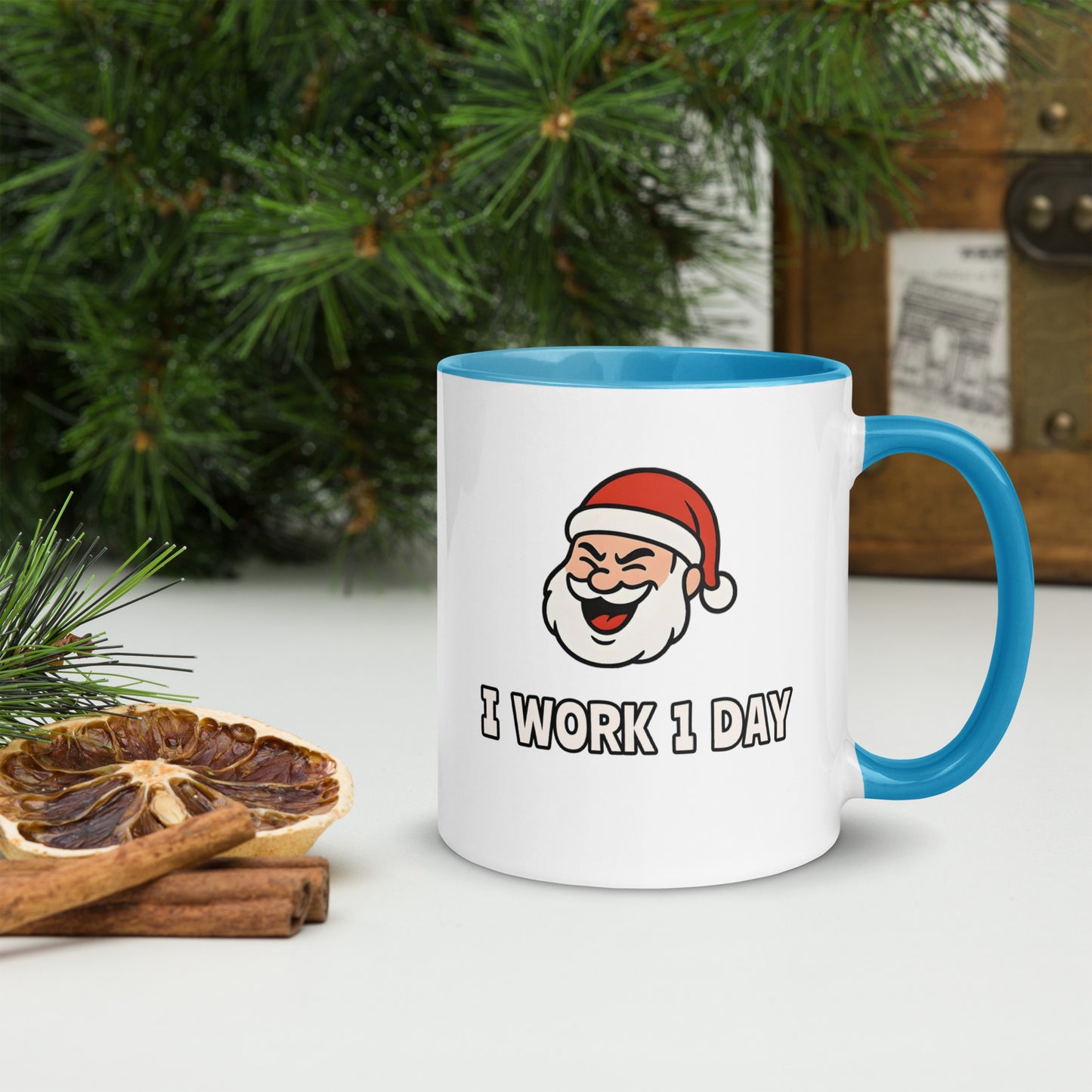 White ceramic mug with color inside featuring winking Santa Claus face and "I WORK 1 DAY" text
