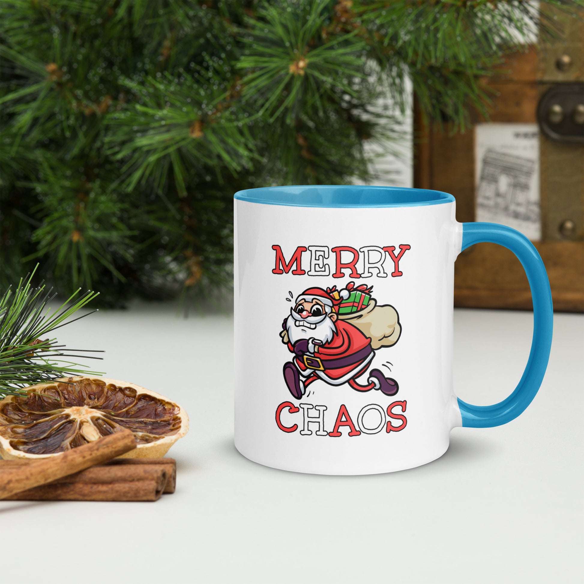 White ceramic mug with color inside featuring funny running Santa Claus and "MERRY CHAOS" text