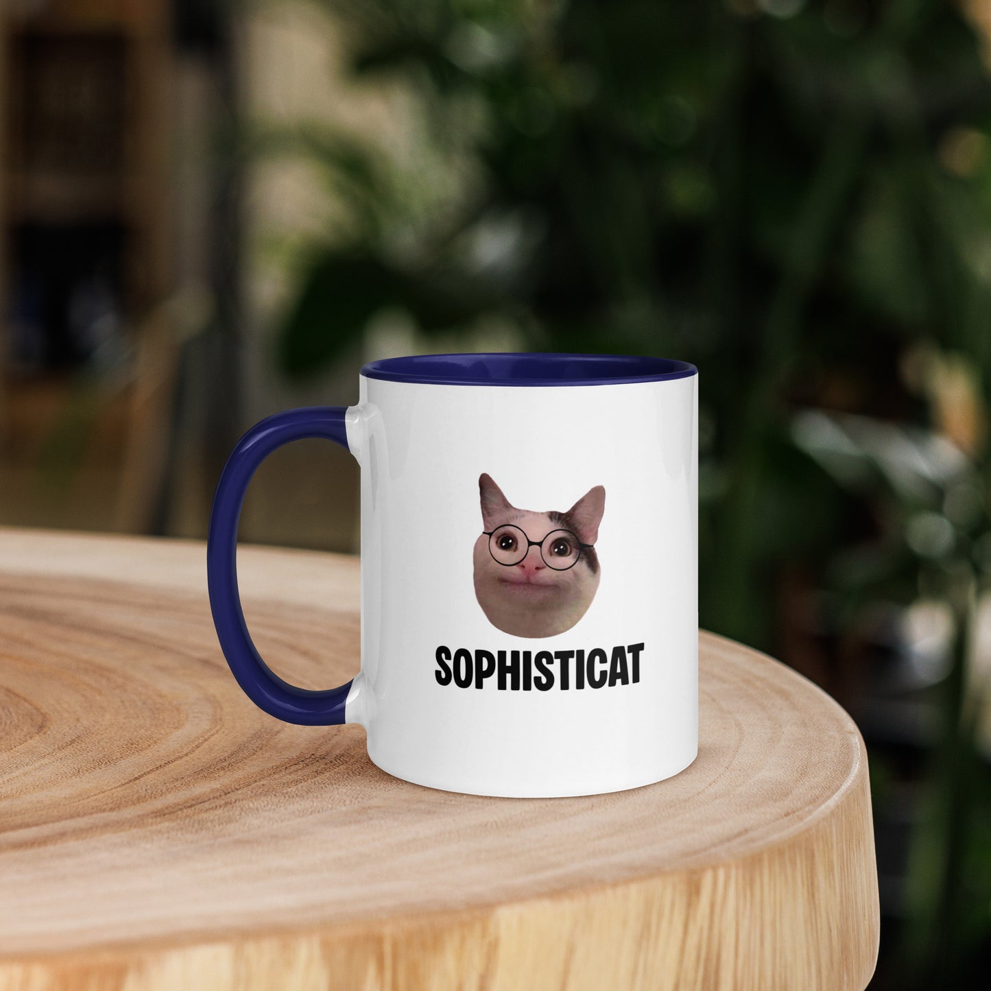 White ceramic mug with color inside featuring Beluga cat wearing glasses and "SOPHISTICAT" text