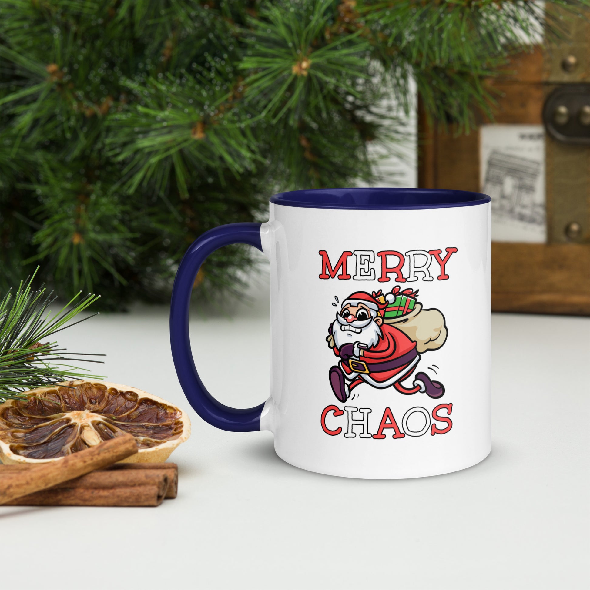 White ceramic mug with color inside featuring funny running Santa Claus and "MERRY CHAOS" text