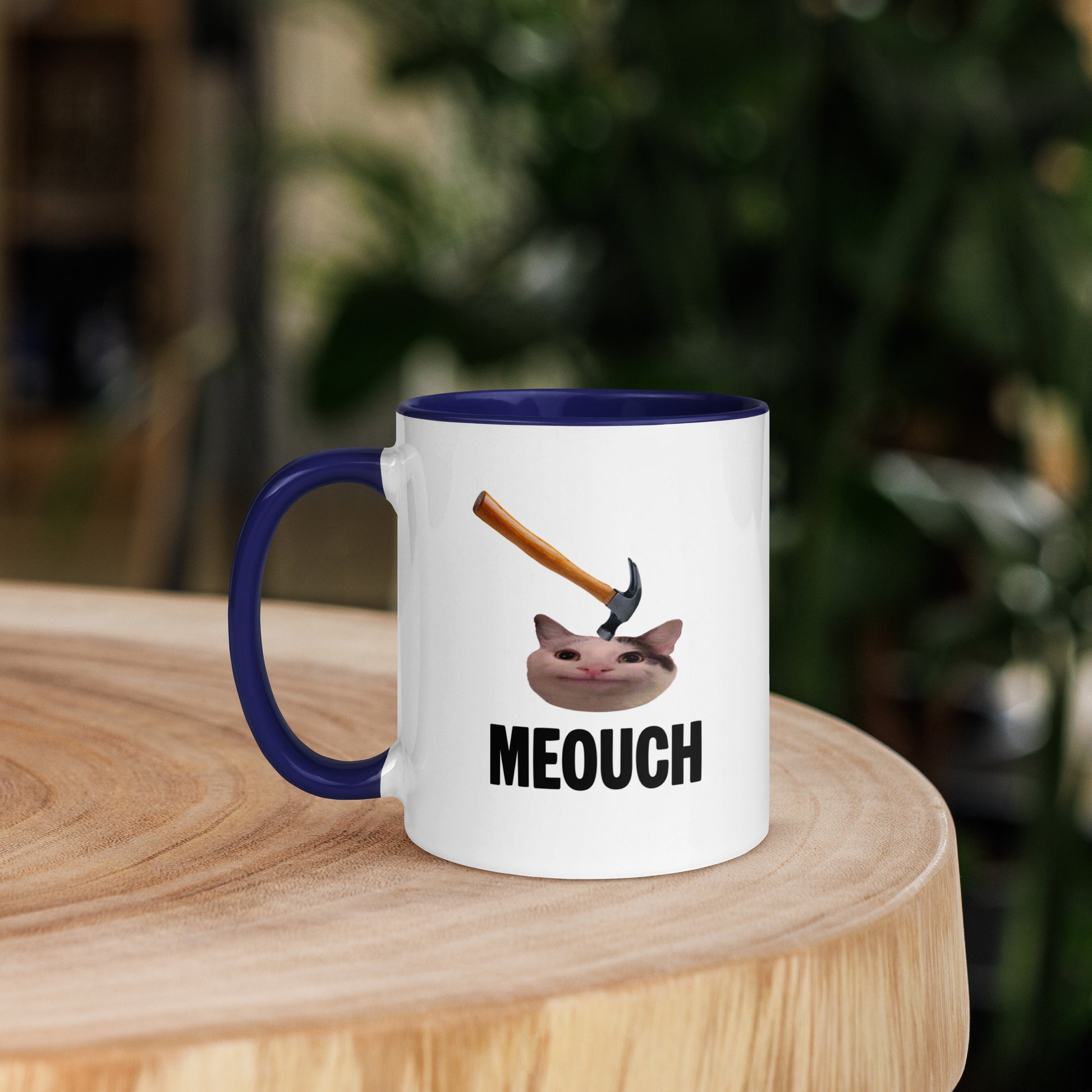 White ceramic mug with Color inside featuring funny Meouch cat meme and hammer design