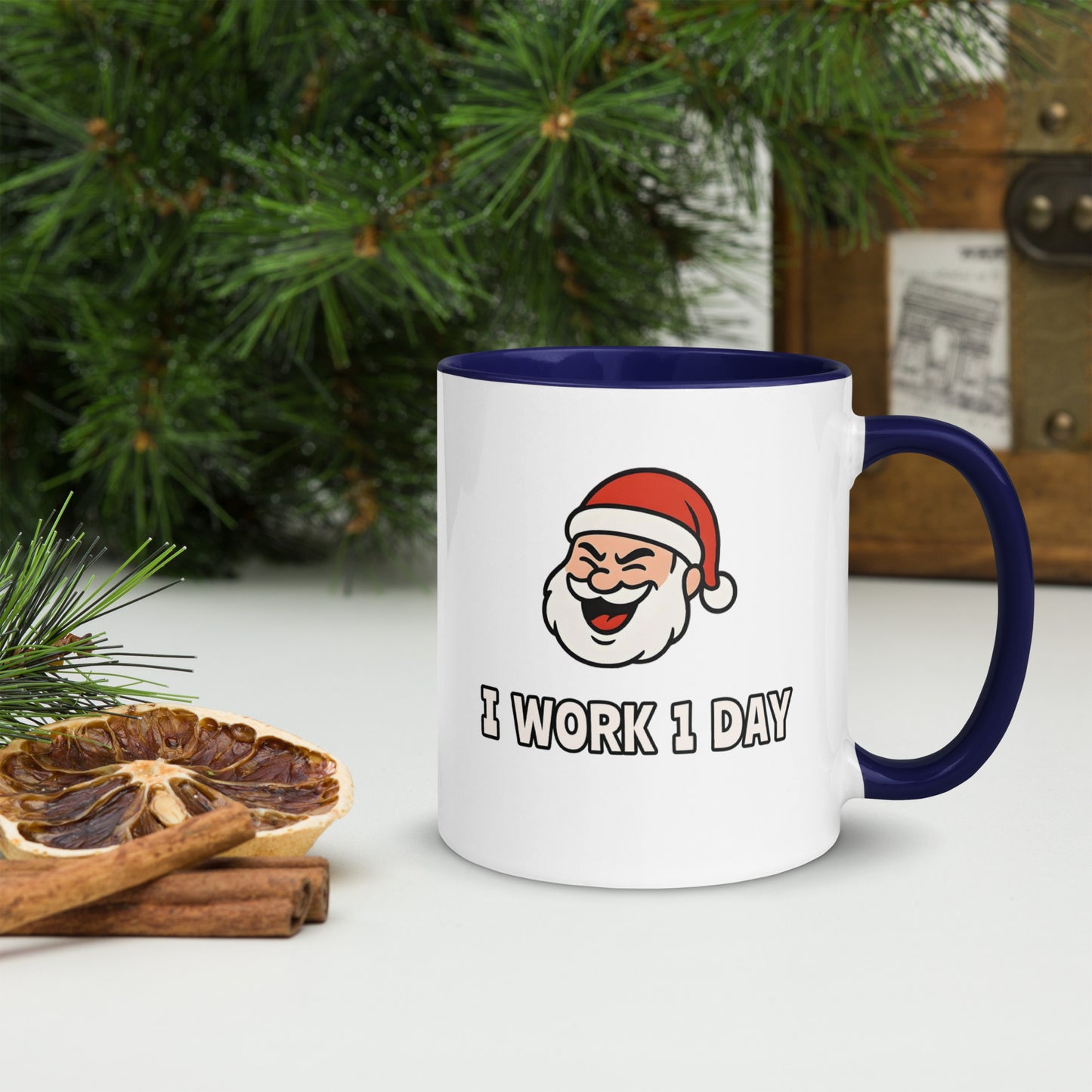 White ceramic mug with color inside featuring winking Santa Claus face and "I WORK 1 DAY" text