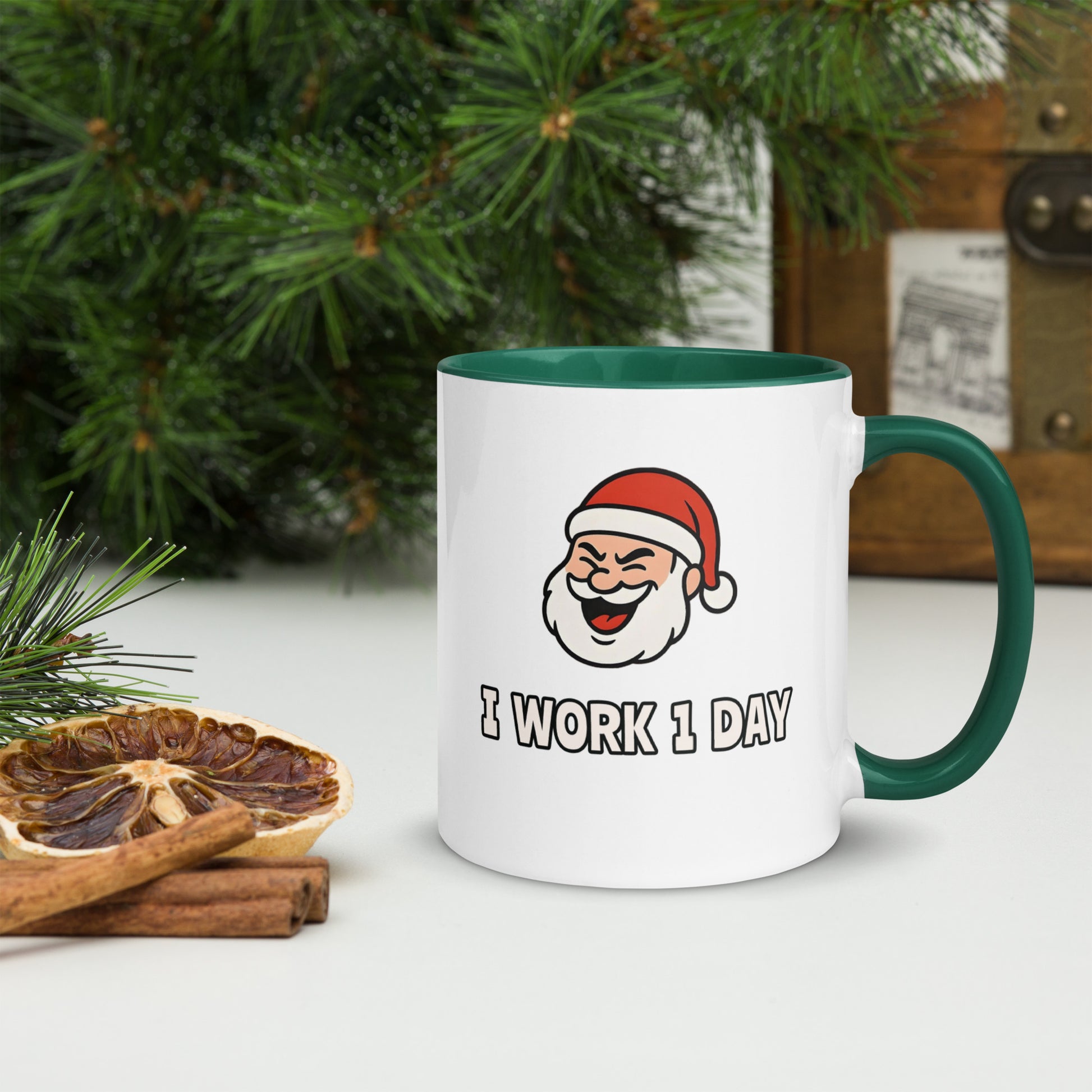 White ceramic mug with color inside featuring winking Santa Claus face and "I WORK 1 DAY" text