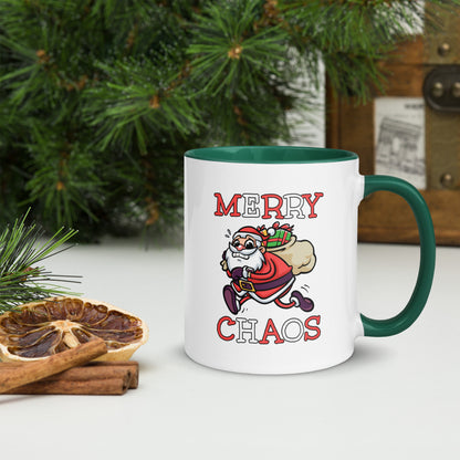 White ceramic mug with color inside featuring funny running Santa Claus and "MERRY CHAOS" text
