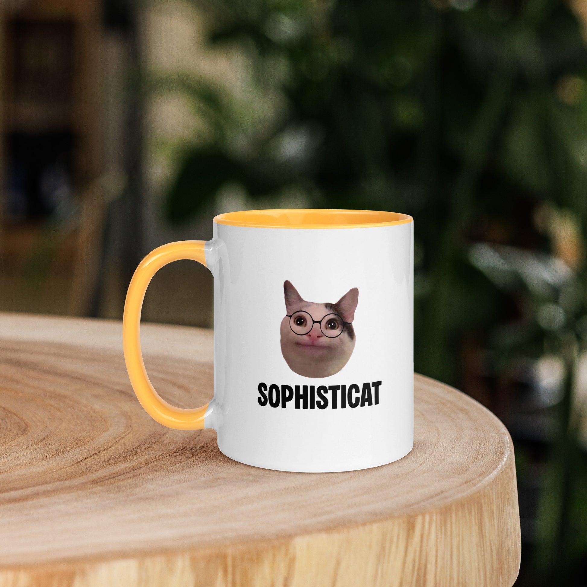 White ceramic mug with color inside featuring Beluga cat wearing glasses and "SOPHISTICAT" text