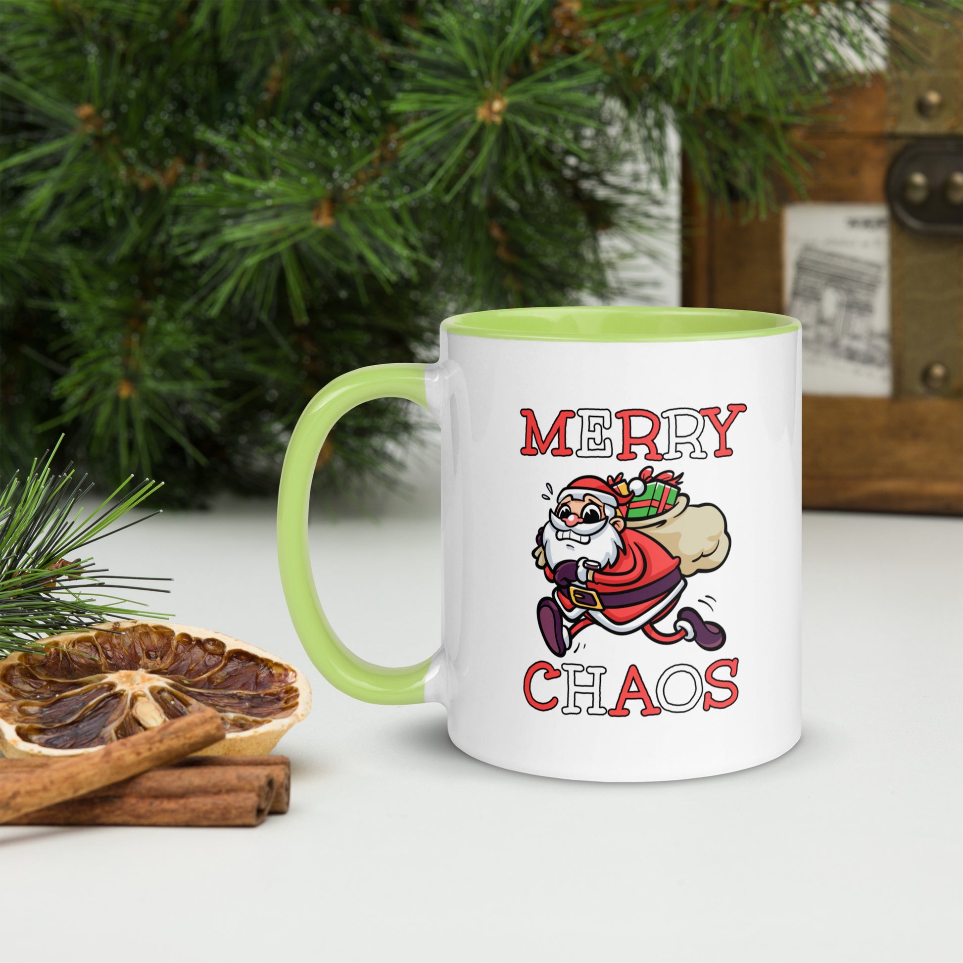White ceramic mug with color inside featuring funny running Santa Claus and "MERRY CHAOS" text