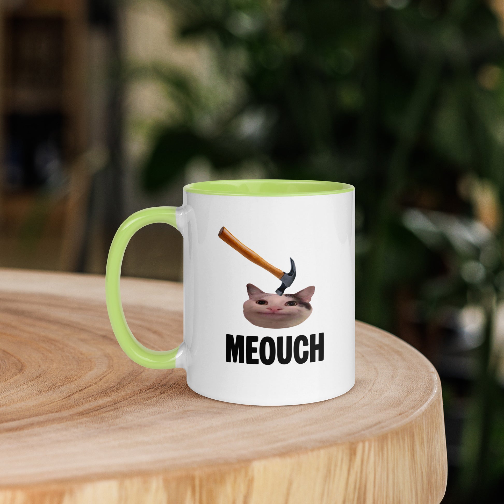 White ceramic mug with Color inside featuring funny Meouch cat meme and hammer design