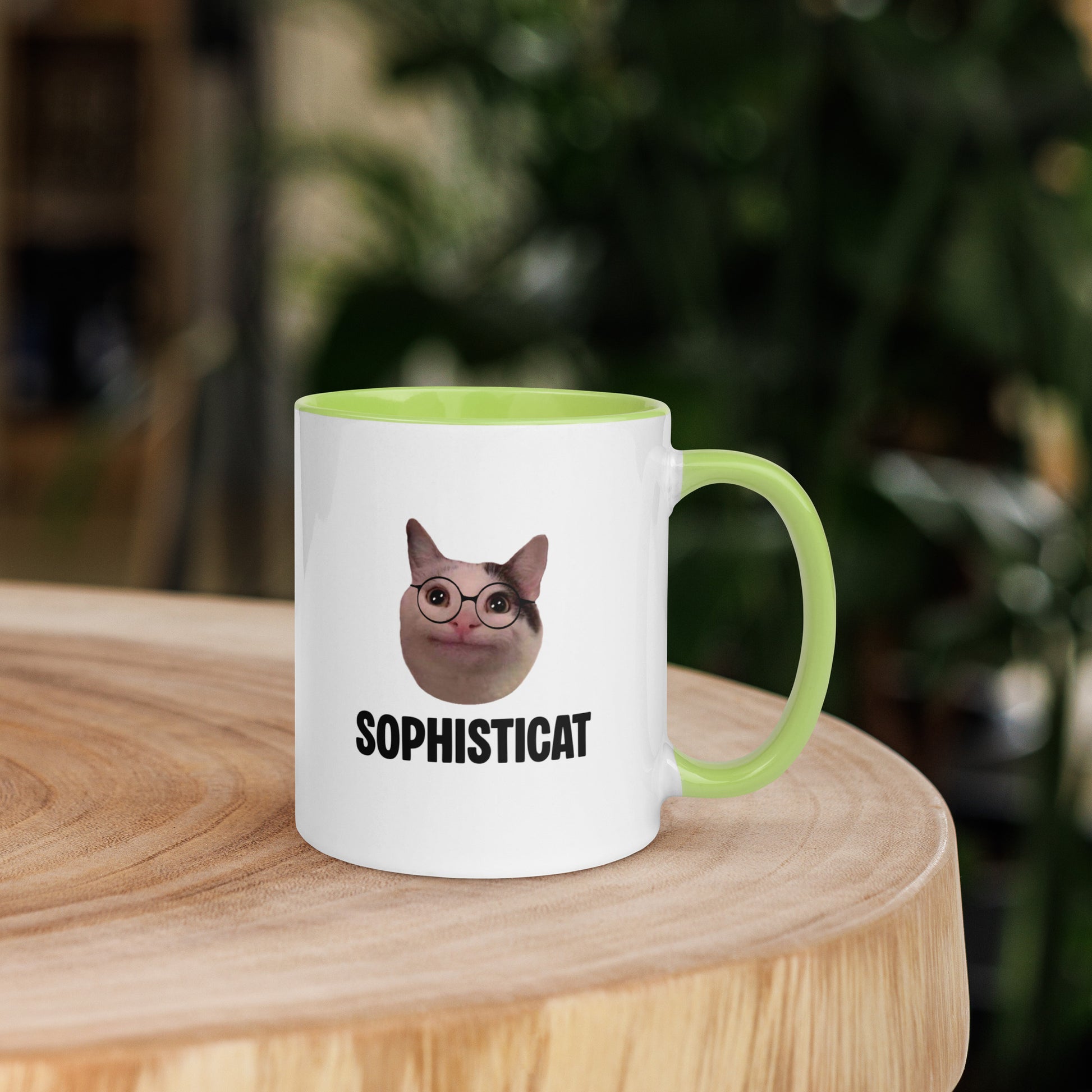 White ceramic mug with color inside featuring Beluga cat wearing glasses and "SOPHISTICAT" text