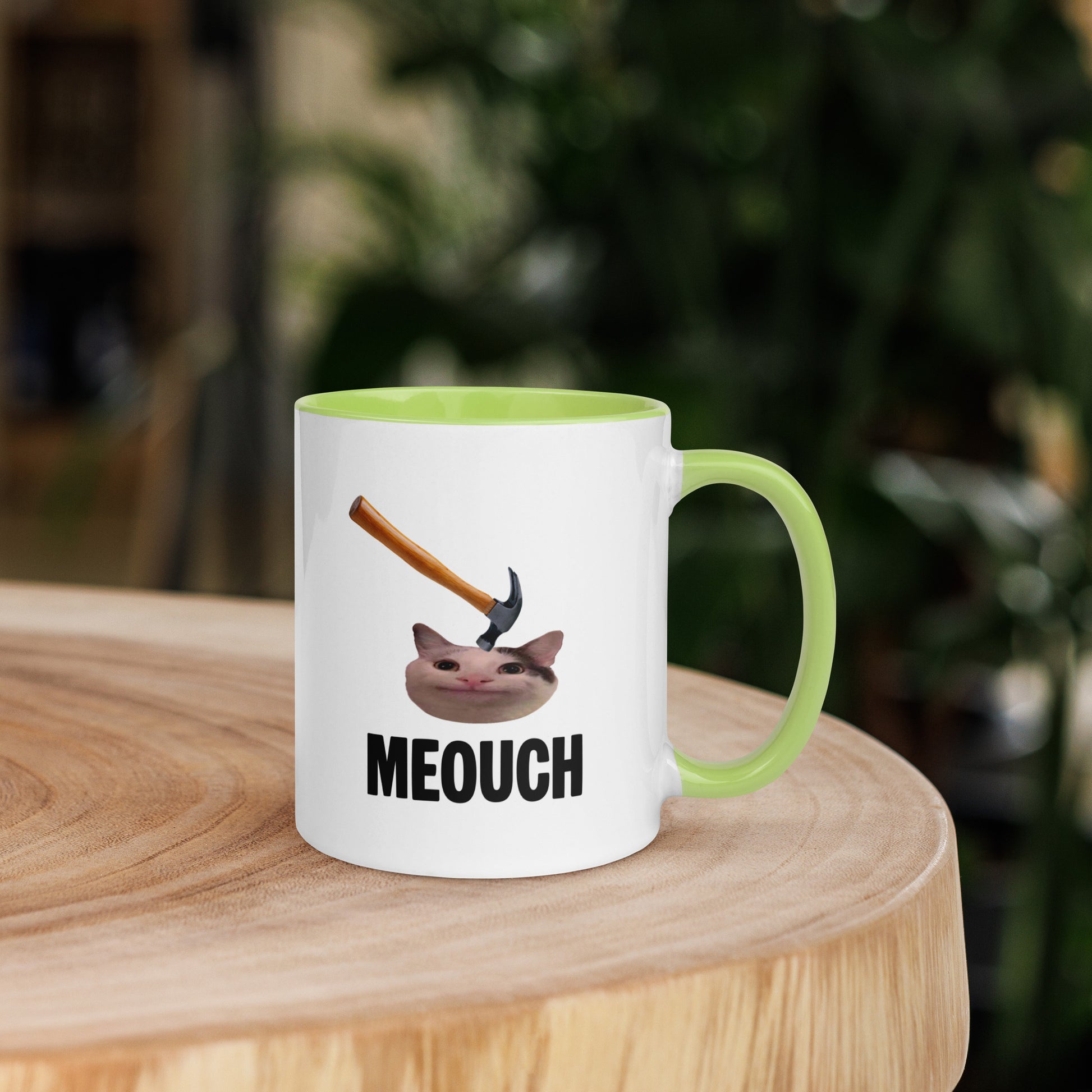 White ceramic mug with Color inside featuring funny Meouch cat meme and hammer design