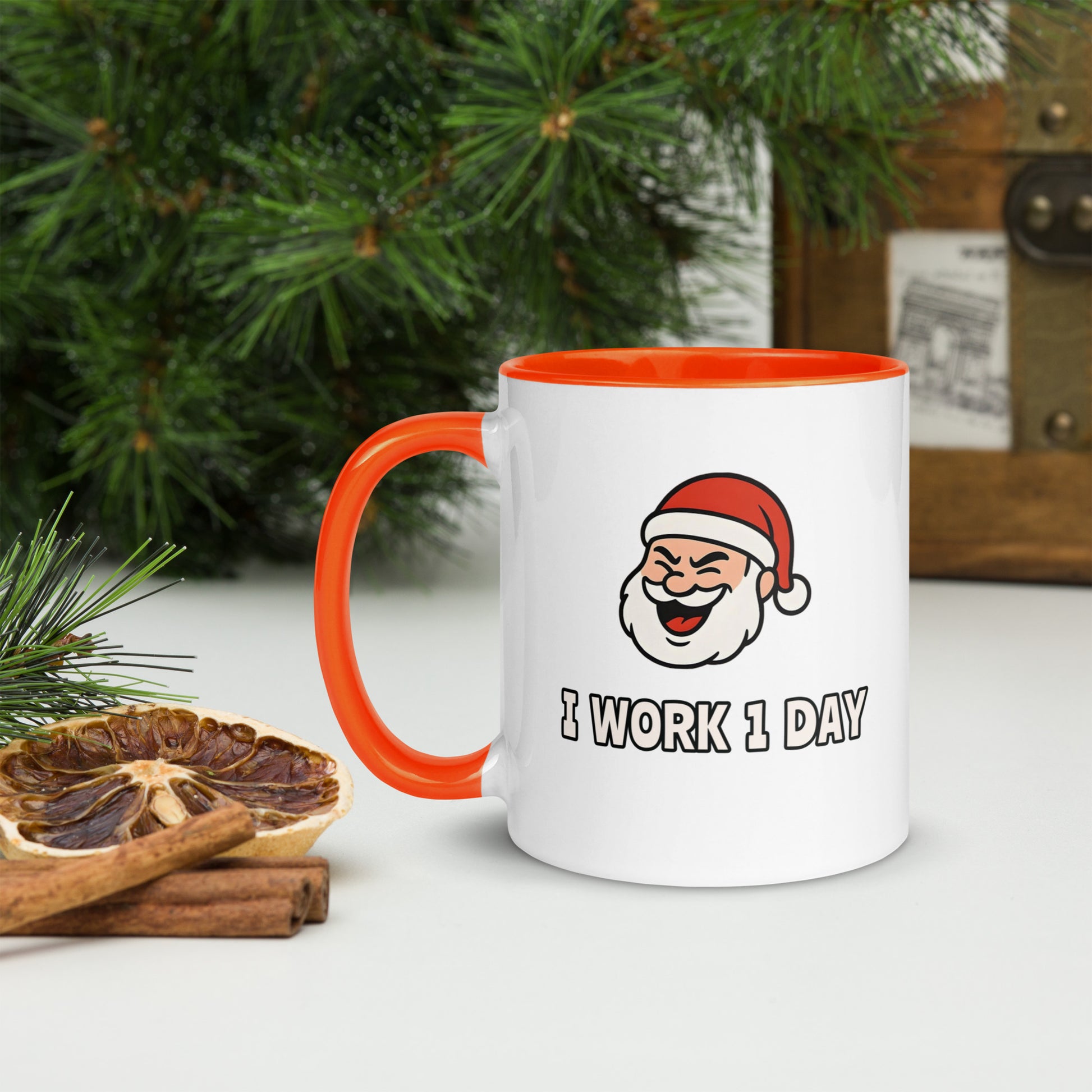 White ceramic mug with color inside featuring winking Santa Claus face and "I WORK 1 DAY" text