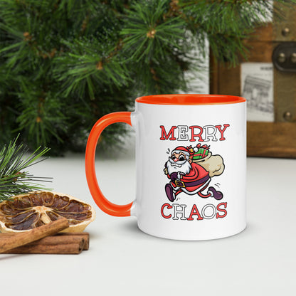 White ceramic mug with color inside featuring funny running Santa Claus and "MERRY CHAOS" text