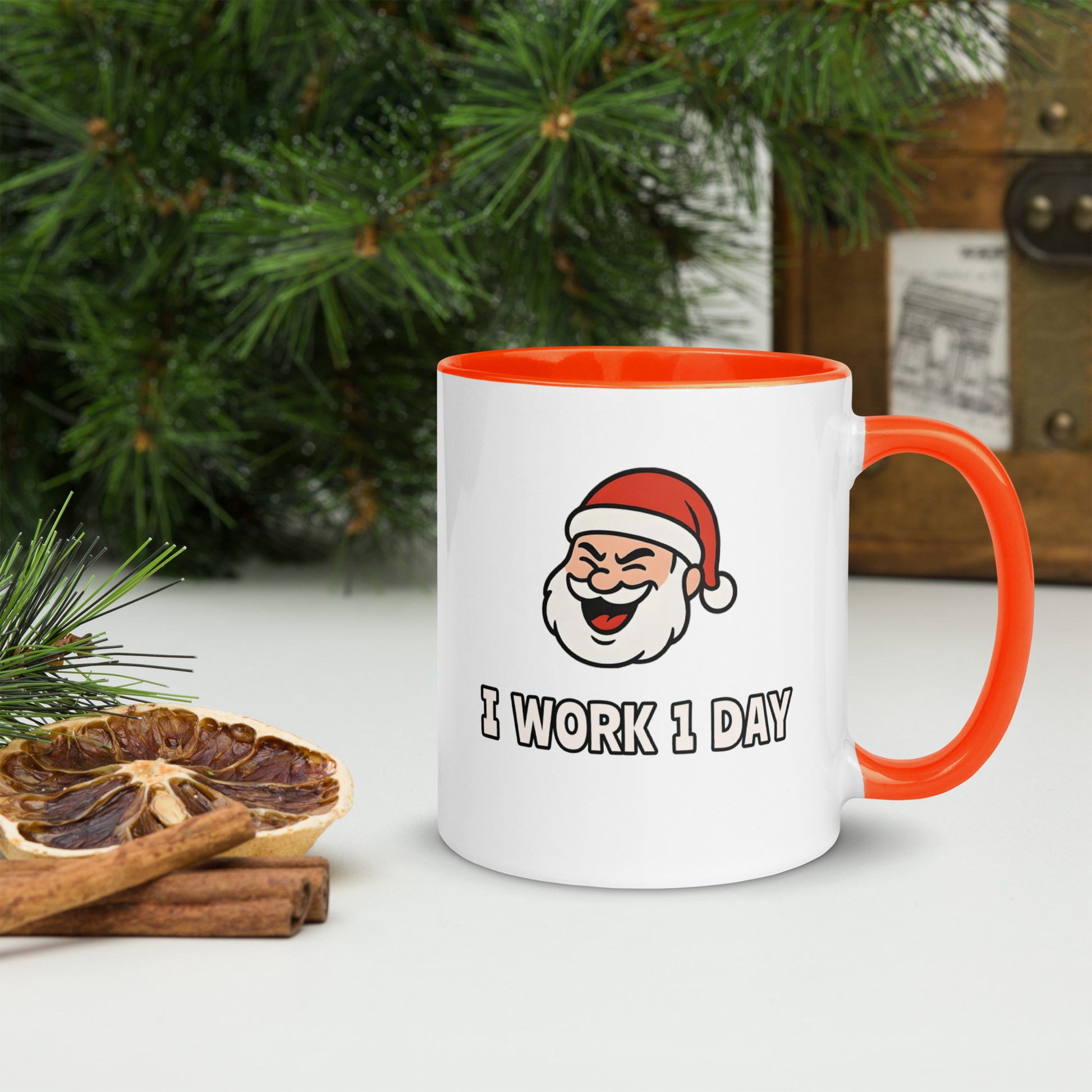 White ceramic mug with color inside featuring winking Santa Claus face and "I WORK 1 DAY" text