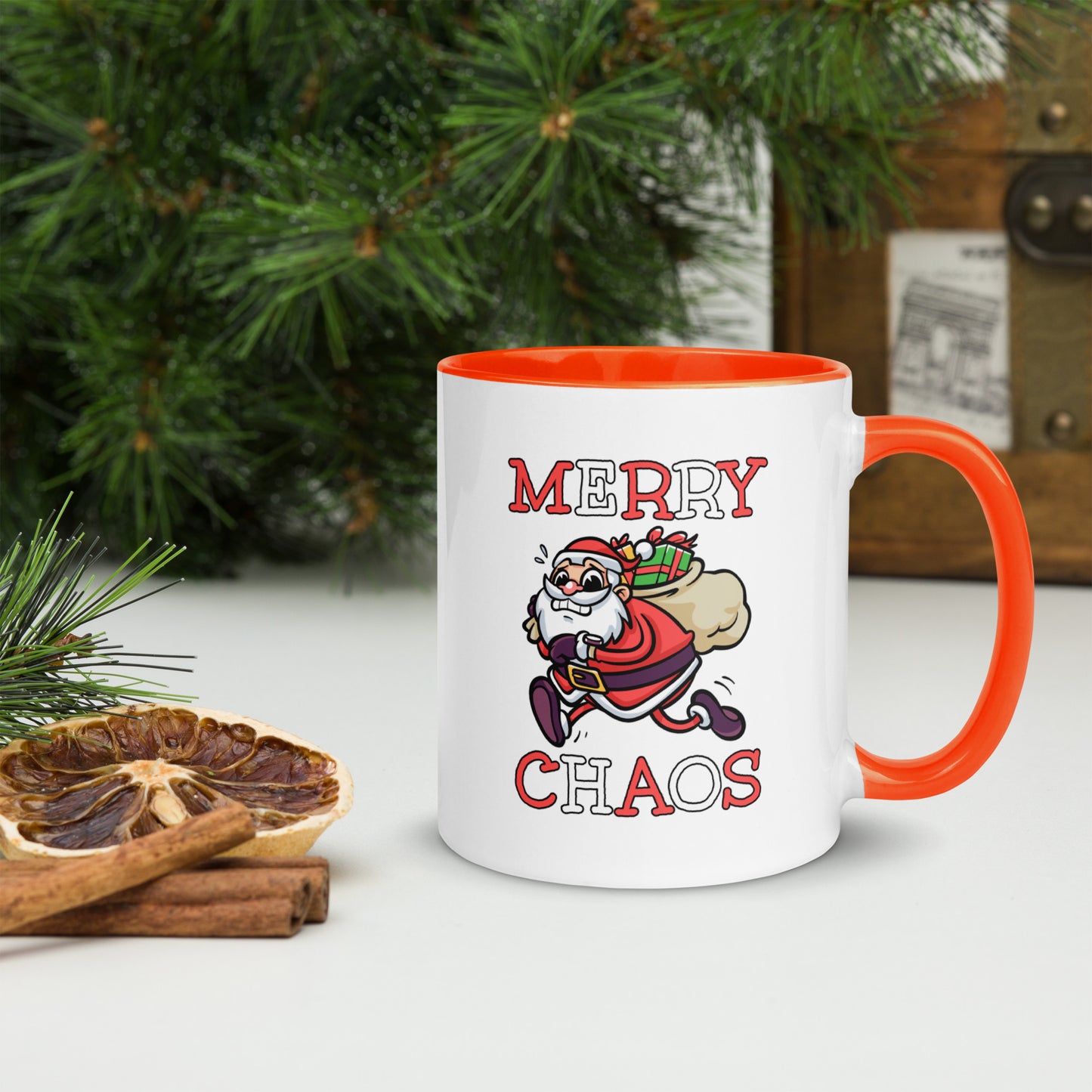 White ceramic mug with color inside featuring funny running Santa Claus and "MERRY CHAOS" text