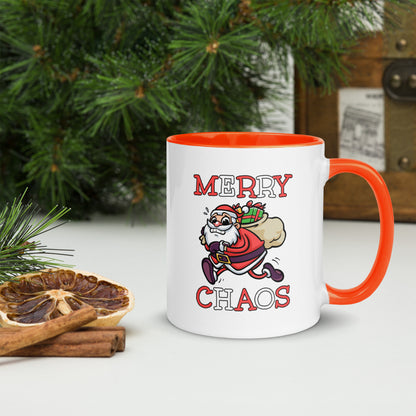 White ceramic mug with color inside featuring funny running Santa Claus and "MERRY CHAOS" text