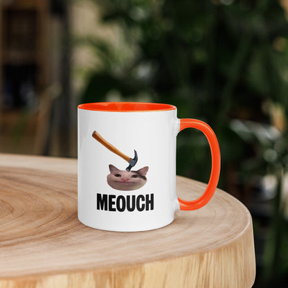White ceramic mug with Color inside featuring funny Meouch cat meme and hammer design