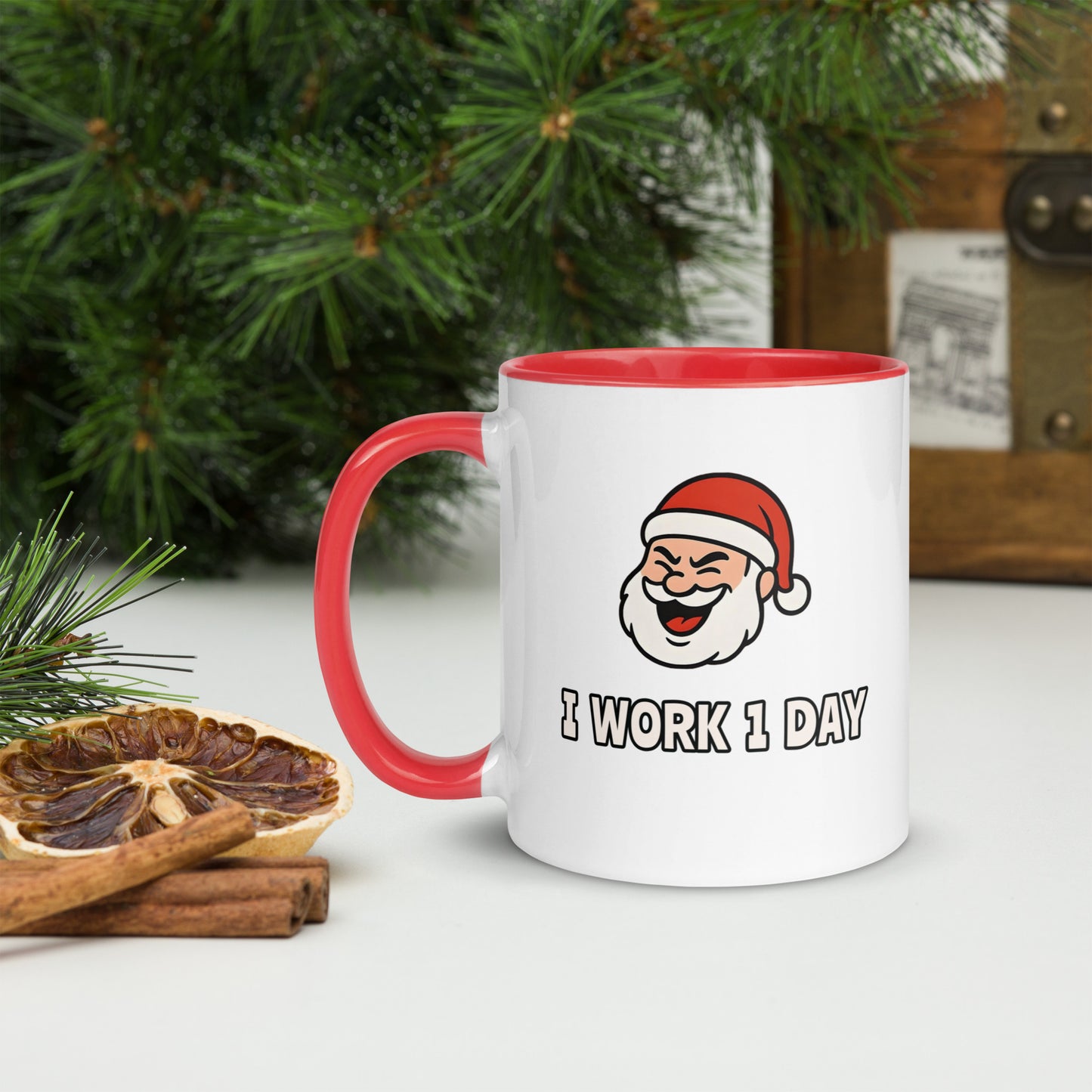 White ceramic mug with color inside featuring winking Santa Claus face and "I WORK 1 DAY" text