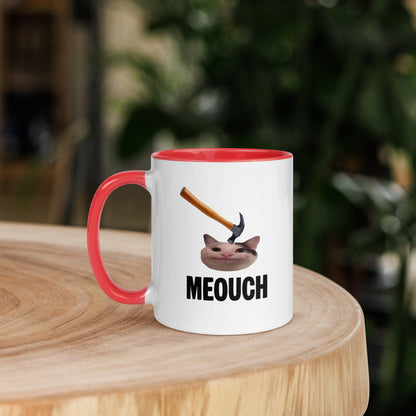 White ceramic mug with Color inside featuring funny Meouch cat meme and hammer design