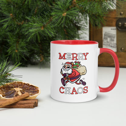 White ceramic mug with color inside featuring funny running Santa Claus and "MERRY CHAOS" text